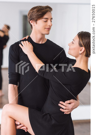 Delighted dance partners looking at each other 27650015