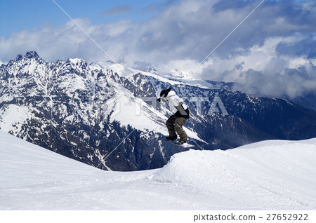 Snowboarder jumping in snow park at ski resort 27652922