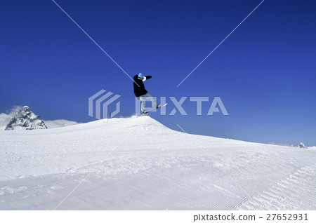 Snowboarder jump in terrain park at ski resort  27652931