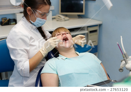 Patient at a reception at the dentist Patient at a reception at the dentist 27653120