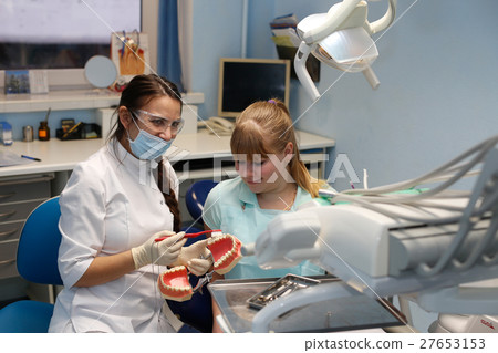 Patient at a reception at the dentist 27653153