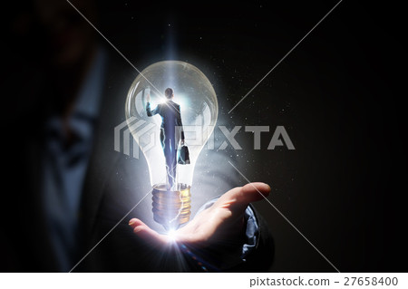 Electric bulb in woman hand Electric bulb in woman hand 27658400