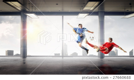 Playing football in office Playing football in office 27660688