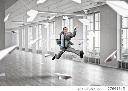 Jumping businessman in office 27661845