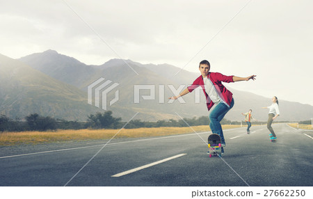 Teenagers ride skateboards 27662250