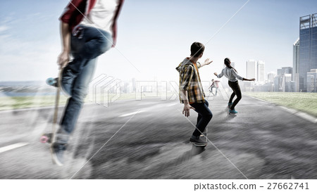 Teenagers ride skateboards 27662741
