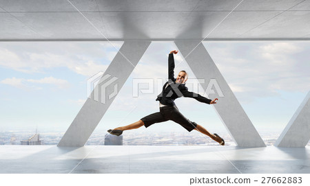 Dancing businesswoman in office 27662883