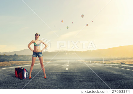 Hitch hiker woman on road 27663374