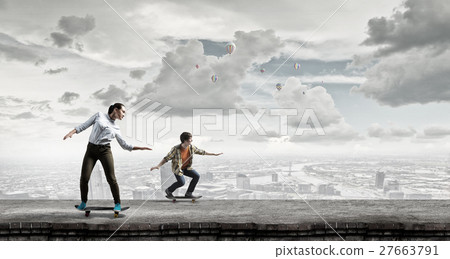 Teenagers ride skateboards 27663791