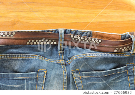 blue jeans with brown leather belt 27666983