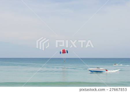 Parasailing on the beach with speed boat in Phuket 27667853