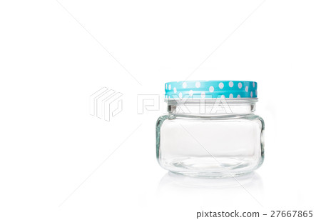 empty glass jar with blue dotted lid on white empty glass jar with blue dotted lid on white 27667865