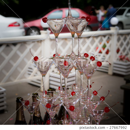 Pyramid of glasses at a wedding ceremony Pyramid of glasses at a wedding ceremony 27667992