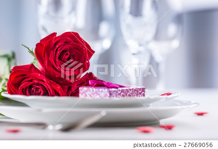 Table setting for valentines day with red roses. Table setting for valentines day with red roses. 27669056