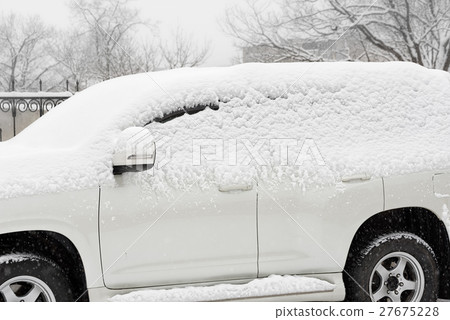 Car in the snow 27675228