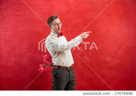Man holding bouquet of carnations behind back Man holding bouquet of carnations behind back 27676996