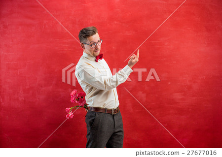 Man holding bouquet of carnations behind back Man holding bouquet of carnations behind back 27677016