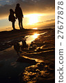 A man and a woman standing while watching sunset on the coast of Enoshima 27677878