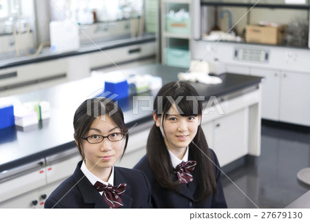 Girls' high school students waiting for classes to start in the science room 27679130