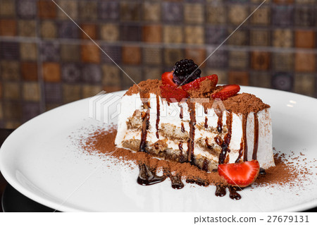 tiramisu on a plate decorated with chocolate 27679131