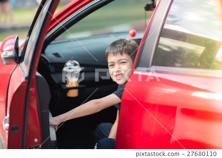 Little boy opening car's door 27680110
