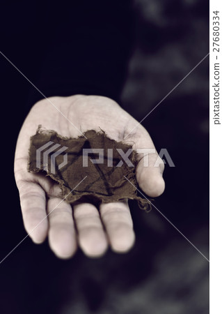 man with a ragged Jewish badge 27680334