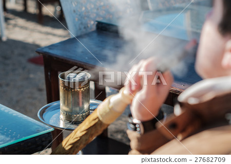 man smoking shisha outdoor man smoking shisha outdoor 27682709