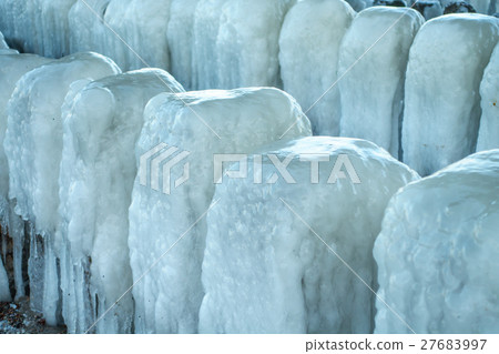 Frozen blocks of ice on the beach Frozen blocks of ice on the beach 27683997