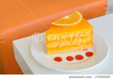 Orange Cake on white table 27684940