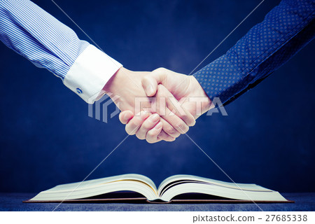 Businessman's handshake, book 27685338