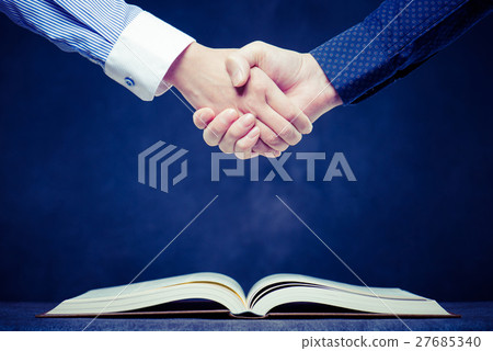 Businessman's handshake, book 27685340