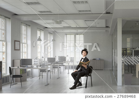 Elegant businessman read old book 27689468