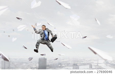 Dancing businesswoman outdoors 27690046