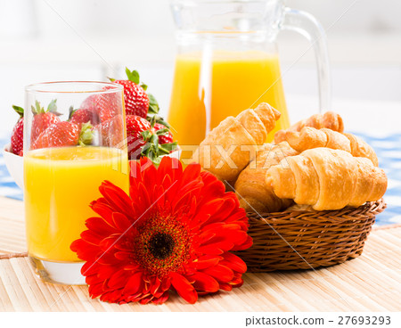early breakfast, juice, croissants and Berries 27693293