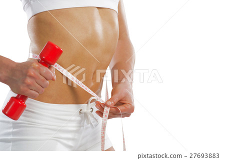 young athletic woman measuring waist 27693883