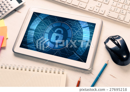 Web security and technology concept with tablet pc on wooden table 27695218