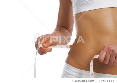 young athletic woman measuring waist 27695442