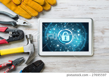 Web security and technology concept with tablet pc on wooden table Web security and technology concept with tablet pc on wooden table 27695597