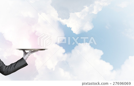 Waiter holding empty silver platter ready for product or item placement Waiter holding empty silver platter ready for product or item placement 27696069