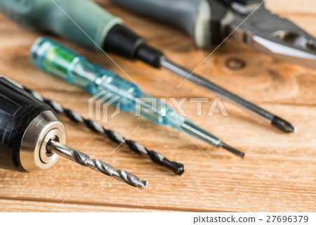 Carpentry tools on wooden surface 27696379
