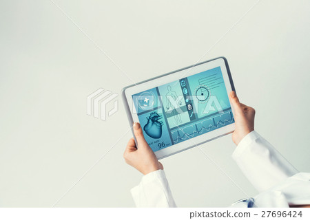 Close of female doctor hands working with tablet pc computer Close of female doctor hands working with tablet pc computer 27696424