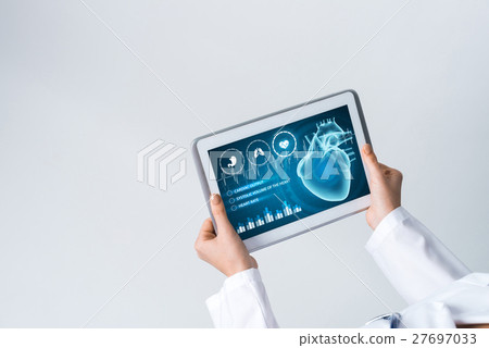 Close of female doctor hands working with tablet pc computer Close of female doctor hands working with tablet pc computer 27697033