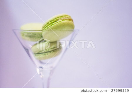 Macarons in cocktail glass on a bright background 27699329