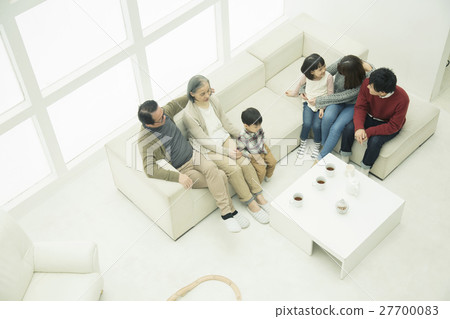 Three generation family sitting on the sofa 27700083