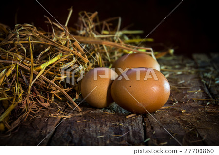 still life eggs in straw on wood background still life eggs in straw on wood background 27700860