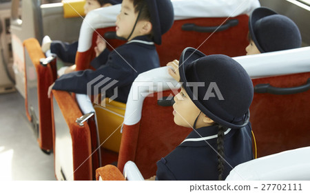 Children aboard a bus service bus Children aboard a bus service bus 27702111