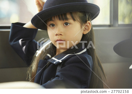 Children aboard a bus service bus 27702158