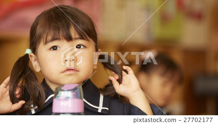 A girl with a water bottle 27702177