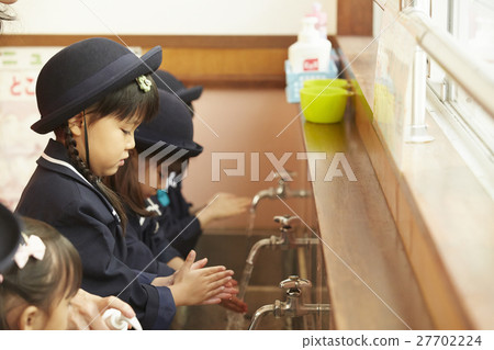Children washing hands 27702224