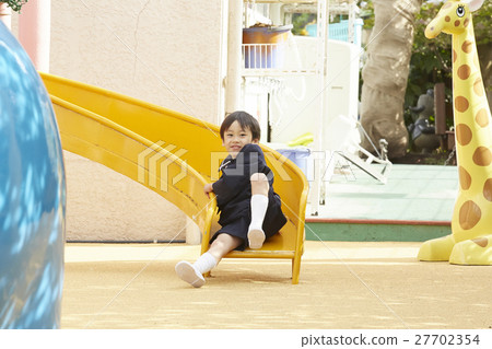 Children playing with playground equipment 27702354